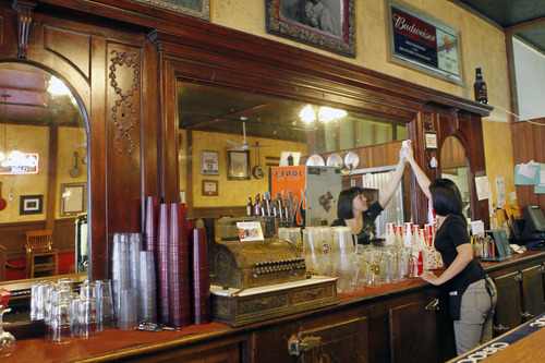Al Hartmann  |  The Salt Lake Tribune
Server Jessica Hanson tends to the venerable bar at the Red Banjo Pizza Parlour.