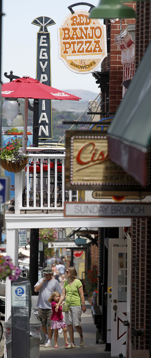 Al Hartmann  |  The Salt Lake Tribune 
Tourists walk the eclectic Park City Main Street past Red Banjo Pizza Parlour. It's Park City's oldest business starting up in 1962.  The restaurant's 50th birthday celebration will take place Sunday.
