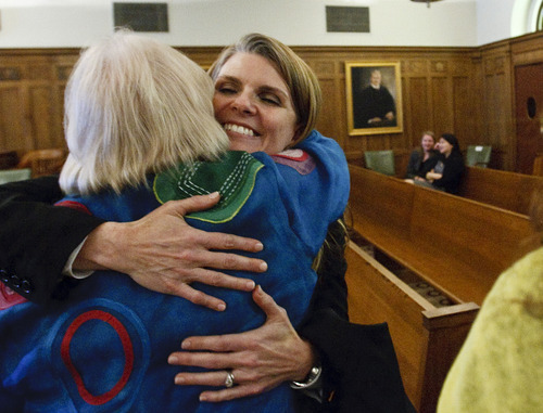 Leah Hogsten  |  The Salt Lake Tribune
Evelyn J. Furse receives a hug from her mother Jonquil Furse after swearing the oath of office of magistrate judge for the U.S. District Court for Utah Friday, June 22, 2012 in Salt Lake City. Furse was a senior attorney for Salt Lake City Corp., where among other things she defended the city's proposed soccer complex bond, before being nominated to fill the position vacated by new federal Judge David Nuffer. Before joining the city, Furse clerked for Utah Supreme Court Justice Christine Durham and then worked for several local law firms. She is a past president of the Women Lawyers of Utah and chaired its Initiative on the Advancement and Retention of Women Attorneys. Furse graduated with a bachelor's degree in public policy analysis from the University of North Carolina in 1993. She attended law school at New York University School of Law in 1996. Magistrate judges conduct preliminary hearings in criminal cases and also handle other criminal and civil matters as assigned by district judges.