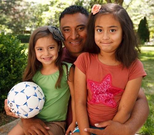 Trent Nelson  |  The Salt Lake Tribune
Kalani Sitake with his daughters Sadie, left, and Skye, Tuesday, June 19, 2012 in Sandy. Being mindful of the rising obesity numbers, Sitake, Utah defensive coordinator, knows firsthand the value of competition in building one's fitness as well as confidence. That is one of the reasons he is a big supporter of Title IX.