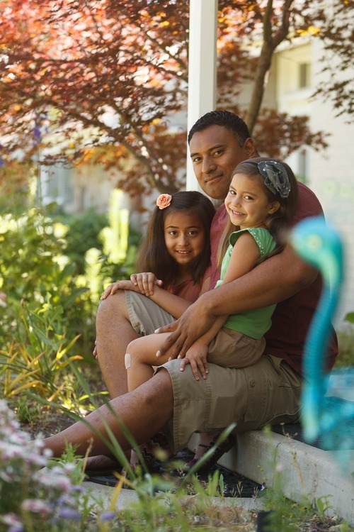 Trent Nelson  |  The Salt Lake Tribune
Kalani Sitake with his daughters Skye, left, and Sadie, Tuesday, June 19, 2012 in Sandy. Being mindful of the rising obesity numbers, Sitake, Utah defensive coordinator, knows firsthand the value of competition in building one's fitness as well as confidence. That is one of the reasons he is a big supporter of Title IX.