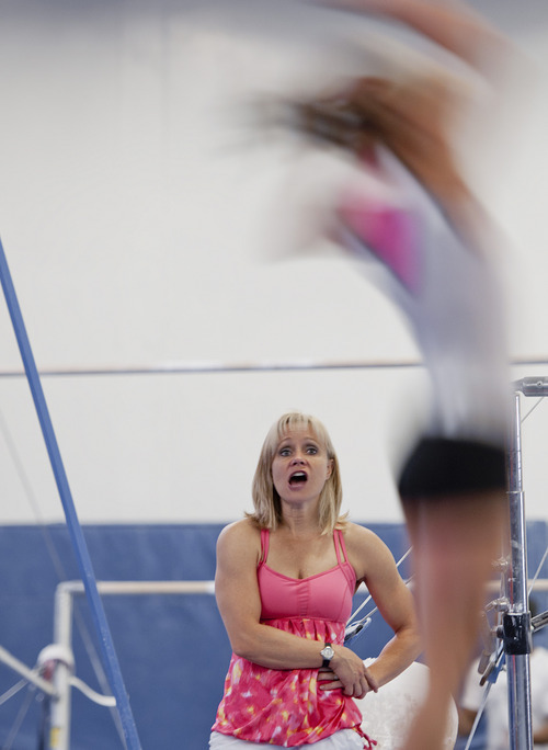 Michael Mangum  |  Special to The Salt Lake Tribune

Melissa Marlowe, coach at USA Gymnastics World gym in Bountiful and a former Olympic and U. of U. gymnast, coaches her daughter Milan Clausi, 12, during tumbling training on Monday, June 18, 2012.
