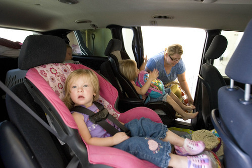 Paul Fraughton  |  The Salt Lake Tribune
Lisel Christiansen packs her van Friday, June 22, 2012, as she prepares to leave her home in Eagle Mountain. Her children Ellie, age 4, and Luci, 2, front, along with their sister Madelyn, 9, and Lisel's mother, Carol Grimaud, piled into the family van and left the neighborhood that was ordered to evacuate as a wildfire came closer to homes in the area.