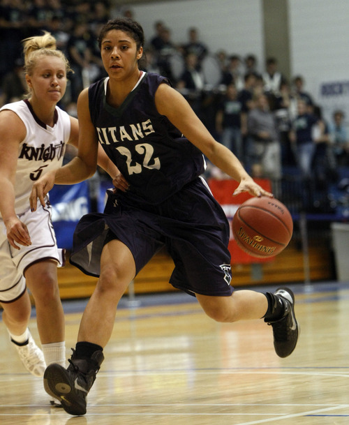 Chris Detrick  |  The Salt Lake Tribune
Syracuse's Brittney Martin (22) runs past Lone Peak's Lauren Lefrandt (5) during the game at Salt Lake Community College Thursday, Feb. 23, 2012. Syracuse won the game 66-43.