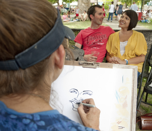Michael Mangum  |  Special to the Tribune

Caricature artist Karen DeBirk sketches Scott Czech and Adrian Molina, of Bountiful at the Utah Arts Festival in downtown Salt Lake City on Sunday, June 24, 2012.