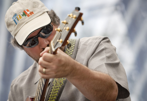 Michael Mangum  |  Special to the Tribune

Guitarist George Schoemaker plays in a group performance of the Salt Lake City-based celtic fusion band named Stonecircle at the Utah Arts Festival in downtown Salt Lake City on Sunday, June 24, 2012.
