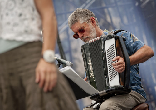 Michael Mangum  |  Special to the Tribune

Steve Keen plays the accordion in a group performance of the Salt Lake City-based celtic fusion band named Stonecircle at the Utah Arts Festival in downtown Salt Lake City on Sunday, June 24, 2012.