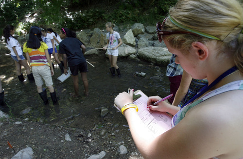 Francisco Kjolseth  |  The Salt Lake Tribune
Evanny Schaffer, 13, of Murray writes down the results of organisms found in Emigration Creek as Westminster college hosts asummer camp for girls entering  8th grade. The AWE+SUM camp is designed specifically to get girls interested in math and science.
