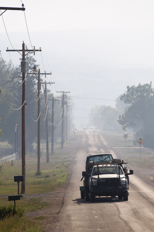 Michael Mangum  |  Special to The Salt Lake Tribune

Smoke fills the streets of Fairview after an evacuation order for the town had been given due to proximity of the Wood Hollow fire in Sanpete county on Tuesday, June 26, 2012.