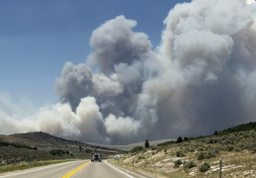 Al Hartmann  |  The Salt Lake Tribune  
Car heads north on U.S HIghway 89  on Tuesday, June 26, 2012, about 2:15 p.m., towards the Wood Hollow fire smoke plume near Indianola.    The fire was reinvigorated from high winds and the highway closed a few minutes later.