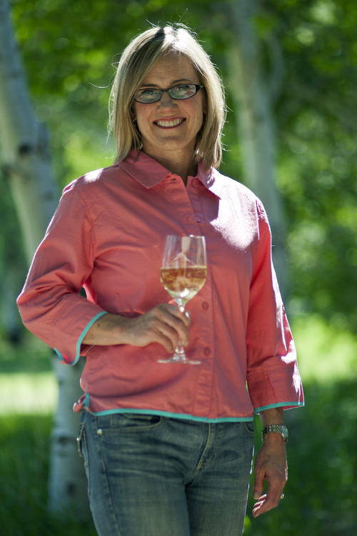 Chris Detrick  |  The Salt Lake Tribune
Kirsten Fox, headmistress at the Fox School of Wine, poses for a portrait with a glass of 2011 Kim Crawford Marlborough Unoaked Chardonnay at her home in Park City on Wednesday June 20, 2012.