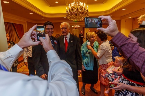 Trent Nelson  |  The Salt Lake Tribune
Senator Orrin Hatch poses for photos with supporters on election night at the Little America Hotel in Salt Lake City, Utah, Tuesday, June 26, 2012. Kyle Palmer, chair of the Utah Teenage Republicans is standing with Hatch.