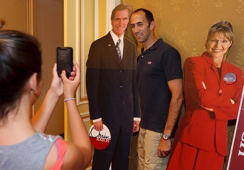 Trent Nelson  |  The Salt Lake Tribune
Joseph Borrack poses with cutouts of Mitt Romney and Sarah Palin while his daughter Olivia takes a photo on election night at the Little America Hotel in Salt Lake City, Utah, Tuesday, June 26, 2012.