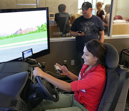 Lennie Mahler  |  The Salt Lake Tribune
Aliya Khan, 16, drives a simulator while texting at the Utah Traffic Lab on the University of Utah campus. The simulator is designed to place the driver in dangerous situations where reaction time is crucial. The simulator tracks drivers' times, crashes and the way the driver interacts with other cars on the road.