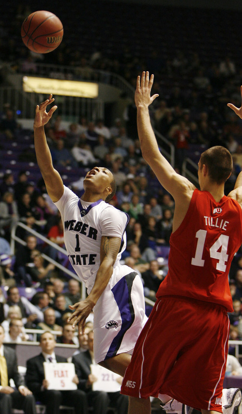 Steve Griffin  |  The Salt Lake Tribune

Ogden -  Weber State's Damian Lillard scopes in two over Utah's Kim Tillie during first half action of the their basketball game at the Dee Events Center in Ogden Wednesday Dec 2, 2009,