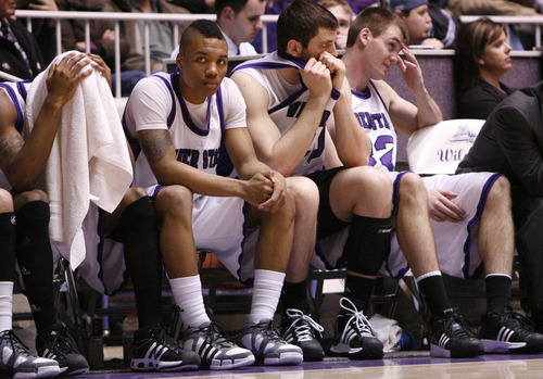 Weber's fouled out Daviin Davis (head covered) and Damian Lillard react with Steve Panos and Darin Mahoney. 
Weber was defeated by Montana State 70-61.
Weber State University played Montana State Tuesday in the Big Sky Conference semifinals.
Photo by Leah Hogsten/ The Salt Lake Tribune
Ogden 3/10/09