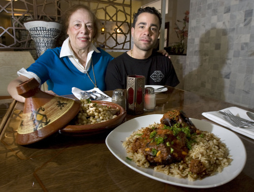 Steve Griffin  |  The Salt Lake Tribune
Leila Tadros and her son Tony Tadros with a plate of Mougrabieh and a plate of Lebanese Moussaka at their restaurant Layla Mediterranean Grill in Holladay. Many of the menu recipes come from Leila's mother.