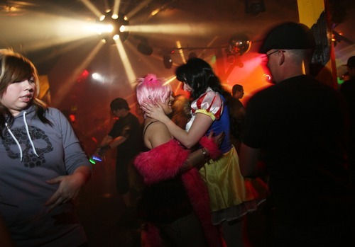 Kim Raff | The Salt Lake Tribune
Kat Harris, left and center, and Charity Vasquez dance on the dance floor during Area 51's Disney theme Fetish Ball in Salt Lake City on May 26, 2012. The club has a monthly themed fetish ball on the last Saturday of every month.