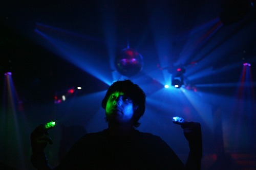 Kim Raff | The Salt Lake Tribune
Nick Pace dances with lights on the dance floor during Area 51's Disney theme Fetish Ball in Salt Lake City on May 26, 2012. The club has a monthly themed fetish ball on the last Saturday of every month.