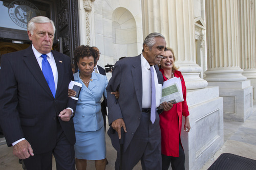 From left, House Minority Whip Steny Hoyer of Md., Rep. Barbara Lee, D-Calif., Rep. Charles Rangel, D-NY, and Rep. Carolyn B. Maloney, D-NY, walk out of the Capitol, arm-in-arm, as members of the Congressional Black Caucus and many House Democrats protest the vote to hold Attorney General Eric Holder in contempt, Thursday, June 28, 2012, on Capitol Hill in Washington.  (AP Photo/J. Scott Applewhite)