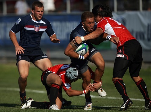 Kim Raff | The Salt Lake Tribune
USA player Noah Tarrant is tackled by Japan players (bottom) Yonghwi Kim and Seiyu Kohara during the Junior World Rugby Trophy 2012 Final at Murray Rugby Park Stadium in Murray, Utah on June 30, 2012.