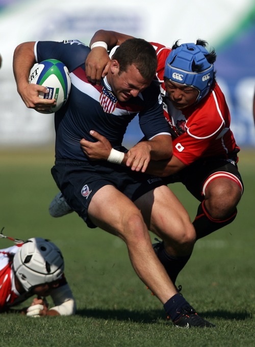 Kim Raff | The Salt Lake Tribune
USA player Tanner Barnes is tackled by Japan's player Kengo Kitagawa during the Junior World Rugby Trophy 2012 Final at Murray Rugby Park Stadium in Murray, Utah on June 30, 2012.