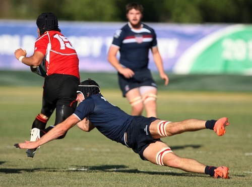 Kim Raff | The Salt Lake Tribune
USA player (right) Glen Thommes attempts to tackle Japan's player Rikiya Matsuda during the Junior World Rugby Trophy 2012 Final at Murray Rugby Park Stadium in Murray, Utah on June 30, 2012.