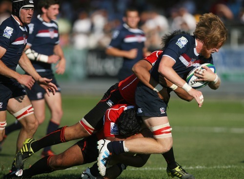 Kim Raff | The Salt Lake Tribune
USA player Alex Goff is tackled by Japan during the Junior World Rugby Trophy 2012 Final at Murray Rugby Park Stadium in Murray, Utah on June 30, 2012.