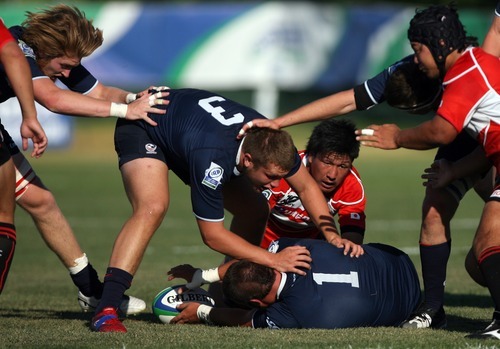 Kim Raff | The Salt Lake Tribune
USA players (bottom) Travis Whitlock and (top) Henry Hall try and maintain control of the ball against Japan during the Junior World Rugby Trophy 2012 Final at Murray Rugby Park Stadium in Murray, Utah on June 30, 2012.