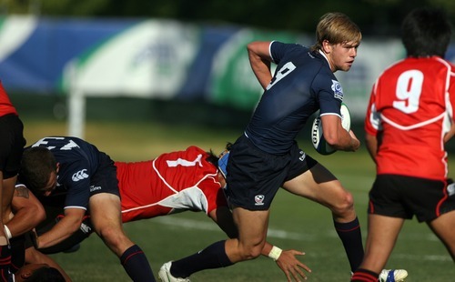 Kim Raff | The Salt Lake Tribune
USA player Nick Boyer makes a run and misses a tackle by Japan player Kengo Kitagawa during the Junior World Rugby Trophy 2012 Final at Murray Rugby Park Stadium in Murray, Utah on June 30, 2012.