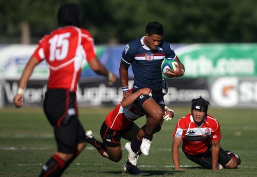 Kim Raff | The Salt Lake Tribune
USA player Tau Laei tries to maintain control of the ball as he is tackled by Japan's player Jumpei Ogura during the Junior World Rugby Trophy 2012 Final at Murray Rugby Park Stadium in Murray, Utah on June 30, 2012.