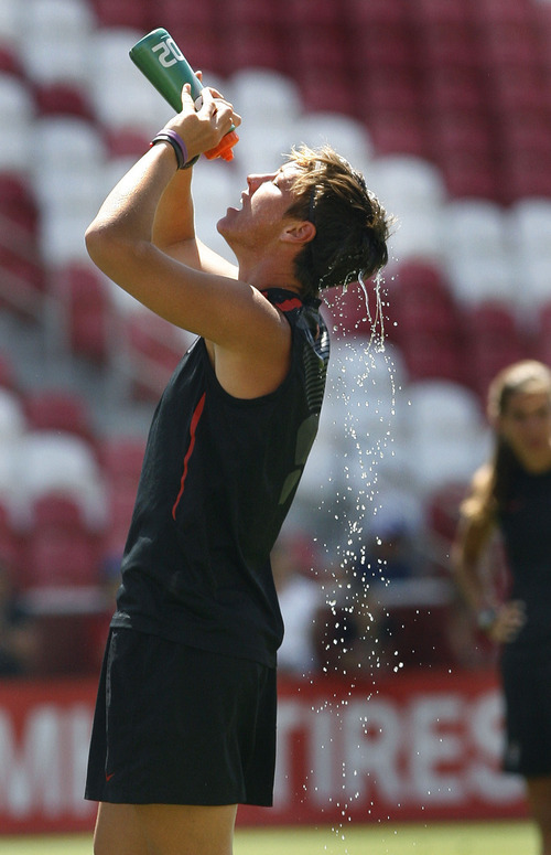 Scott Sommerdorf  |  The Salt Lake Tribune             
Abby Wambach douses herself with water just prior to the U.S. Women's national soccer team's final practice Friday, June 29, 2012 in advance of its Olympic send-off match against Canada at Rio Tinto Stadium on Saturday. The practice session was open to the public.