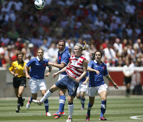 Scott Sommerdorf  |  The Salt Lake Tribune             
USA defender Becky Sauerbrunn (4) battles for the ball during second half play near midfield. The U.S. women's national team beat Canada 2-1 in its final match before going to the London Olympics, Saturday, June 30, 2012.