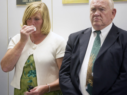 Kim Raff | The Salt Lake Tribune
(left) Angela Rice and Robert Beesley, sister and father to Aaron Beesley, the UHP trooper who died during a search and rescue operation, stand during a press conference about Beesley's death at the UHP's section 3 office in Farmington, Utah on July 1, 2012.