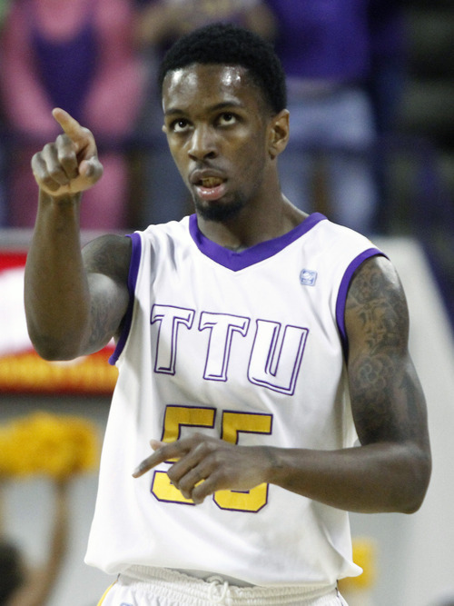 Tennessee Tech's Kevin Murphy (55) points to a teammates after hitting a 3-point shot in the first half of an NCAA college basketball game against Murray State on Saturday, Feb. 25, 2012, in Cookeville, Tenn. (AP Photo/Wade Payne)