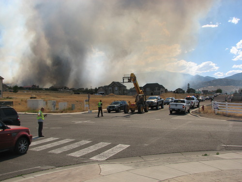 Robert Kirby | The Salt Lake Tribune
A fire burning Friday afternoon in the foothills near Herriman forced mandatory evacuations from 13300 South to 14500 South from 7200 West to 8200 West.