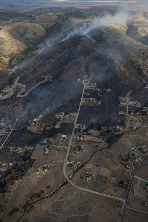 Jeremy Harmon  |  The Salt Lake Tribune

Scorched ground is seen at the fire in the foothills above Herriman on Friday, June 29, 2012.