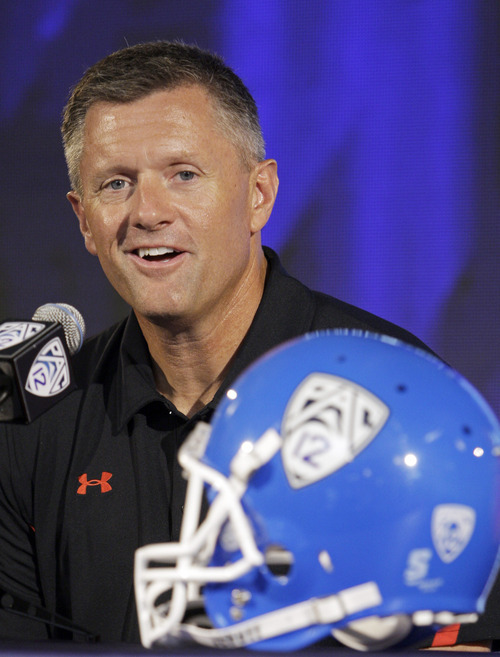 Utah head coach Kyle Whittingham talks to reporters at the Pac-12 football media day in Los Angeles Tuesday, July 26, 2011.  (AP Photo/Reed Saxon)
