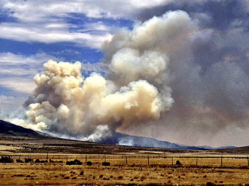 Chris Detrick  |  The Salt Lake Tribune
Smoke rises from The Clay Springs Fire near Scipio, in Millard County, Utah, on Sunday, July 1, 2012.