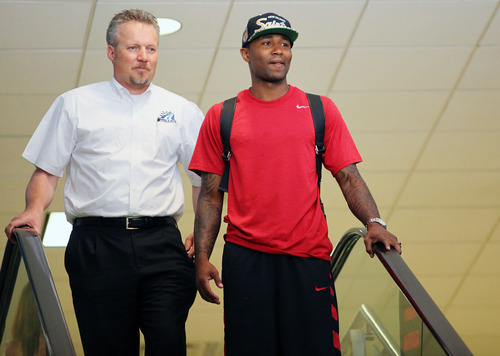 Lennie Mahler  |  The Salt Lake Tribune
Jazz CEO Greg Miller and point guard Mo Williams greet the media for Williams' arrival at the Salt Lake City International Airport on Monday, July 2, 2012.