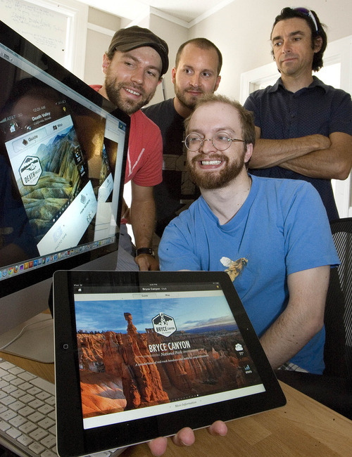 Paul Fraughton | Salt Lake Tribune
Wes Pearce,front, Ben Cline,left,Adam Luptak and Thomas Cooke, of Rally Interactive show off a display of their  app, a guide to national parks in the United States. The app won an Apple Design award for best IPhone  app.
 Monday, June 25, 2012
