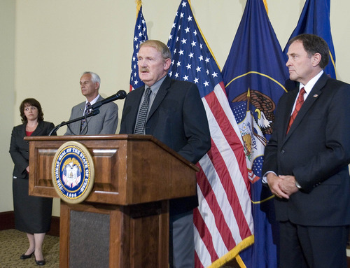 Paul Fraughton | Salt Lake Tribune
State Forester Dick Buehler, with House Speaker Becky Lockhart and Senate President Mike Waddoups to his right and Gov. Gary Herbert on his left, will be working with counties in deciding where target shooting will be limited.
 Monday, July 2, 2012