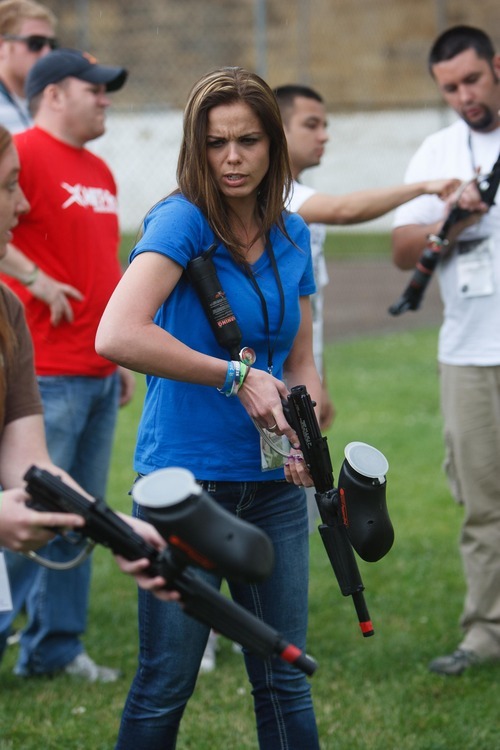 Trent Nelson  |  The Salt Lake Tribune
Jennifer Carver gets hands on with a pepper ball gun during a training session at the Mock Prison Riot, Wednesday, May 9, 2012 in Moundsville, West Virginia.