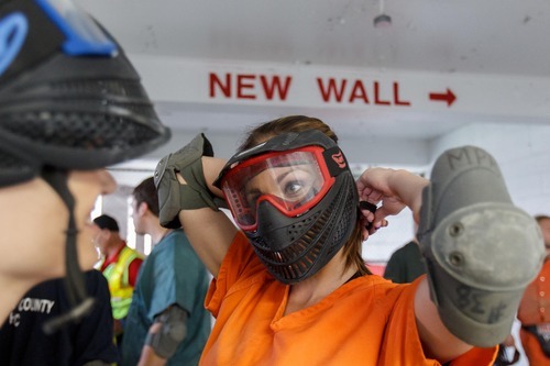 Trent Nelson  |  The Salt Lake Tribune
Role playing as an inmate, Jennifer Carver prepares for a scenario by donning protective gear at the Mock Prison Riot, Monday, May 7, 2012 in Moundsville, West Virginia. At left is Carver's classmate Rachel Taylor.