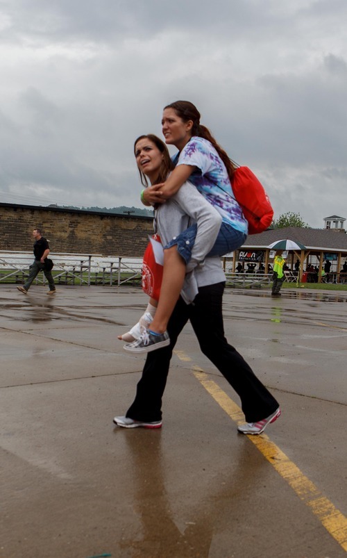 Trent Nelson  |  The Salt Lake Tribune
Jennifer Carver carries an injured classmate, Shalie Barber, at the Mock Prison Riot, Tuesday, May 8, 2012 at the West Virginia Penitentiary in Moundsville, West Virginia.