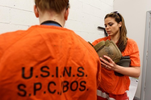 Trent Nelson  |  The Salt Lake Tribune
Sarah Cleverley, left, and Jennifer Carver don prison clothes and protective gear as they prepare to role play as inmates at the Mock Prison Riot, Monday, May 7, 2012 in Moundsville, West Virginia.