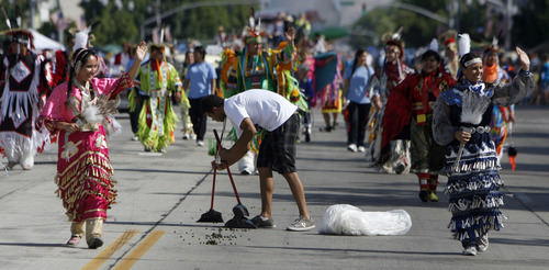 Francisco Kjolseth  |  The Salt Lake Tribune
Nate Swapp finds himself picking up the rear for the Utah Valley Llamas as the parade carries on where thousands lined the streets of downtown Provo to watch the Freedom Festival Parade on Wednesday, July 4, 2012.
