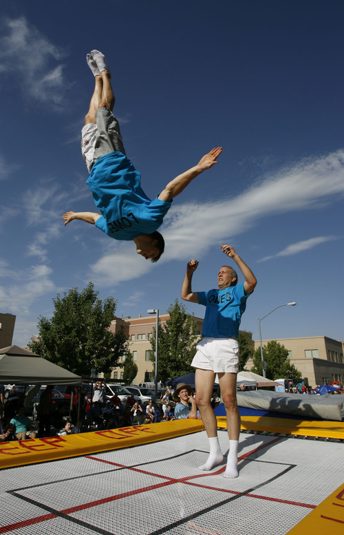 Francisco Kjolseth  |  The Salt Lake Tribune
Members of Lowes Xtreme Airsports delight the crowds with a mobile trampoline as thousands line the streets of downtown Provo to watch the Freedom Festival Parade on Wednesday, July 4, 2012.