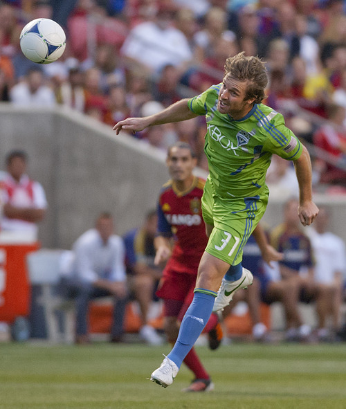 Michael Mangum  |  Special to the Tribune

Seattle Sounders defender Jeff Parke (31) heads the ball to the safety of his defense during their match against Real Salt Lake at Rio Tinto Stadium in Sandy, UT on Wednesday, July 4, 2012.
