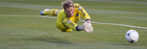 Michael Mangum  |  Special to the Tribune

Seattle Sounders goalkeeper Bryan Meredith (35) dives for the ball after a shot from Real Salt Lake during their match at Rio Tinto Stadium in Sandy, UT on Wednesday, July 4, 2012.